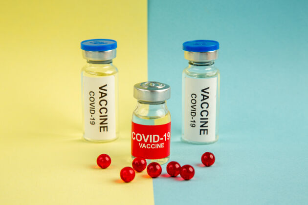 病毒前视图冠状病毒疫苗红色药丸黄蓝色背景医院病毒大流行颜色实验室冠状病毒-科学药物容器正面实验室