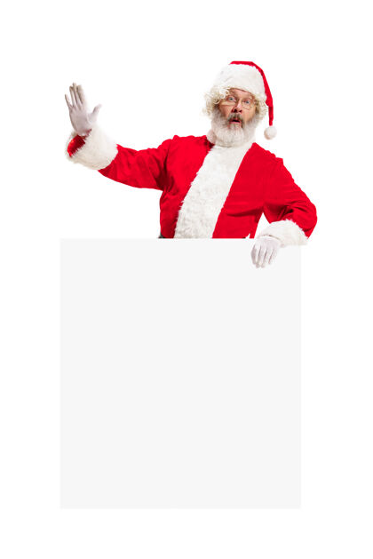 诺埃尔惊喜的圣诞老人指着空白广告欢乐空白高级