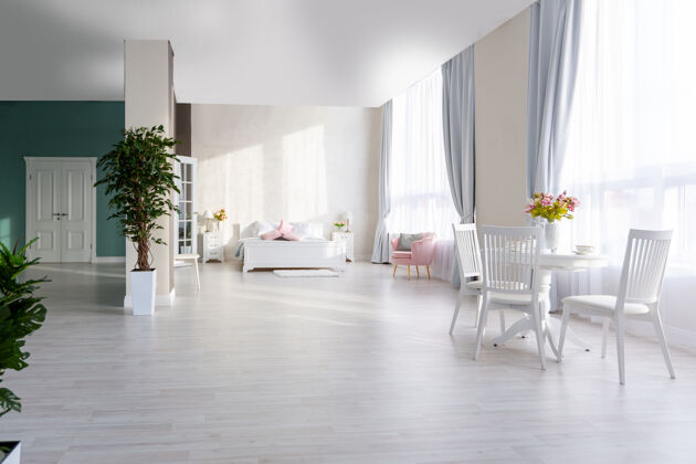 图片豪华和昂贵的开放式公寓室内光线颜色时尚现代化的卧室 最小的设计 用餐区和客人空间斯堪的纳维亚酒店卧室