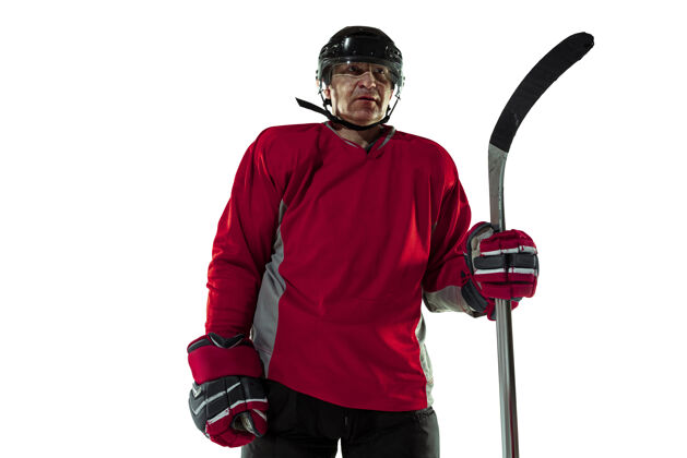 健康自信冰球场上有白色背景的男性冰球运动员运动员穿着装备和头盔练习运动理念 健康的生活方式 运动 运动 动作快速人运动员