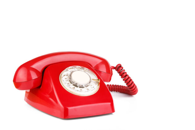 通讯红色的旧电话被隔离在白色的表面上对比复古流行