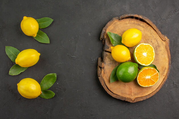 黄色顶视图新鲜的酸柠檬 深色的柠檬 柑橘黄色的水果多汁酸橙健康
