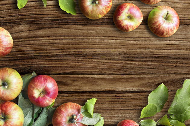 木材红苹果和树叶平放在木桌上乡村木桌食物图像