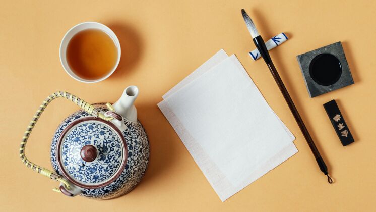 毛笔顶视图中国墨水与空纸的分类水墨构图创意