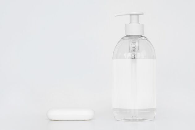 清洁剂一瓶液体肥皂和肥皂条的前视图洗涤包装瓶子