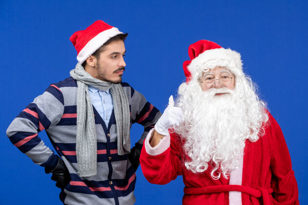 帽子前视图圣诞老人和年轻的男性礼物情感圣诞老人